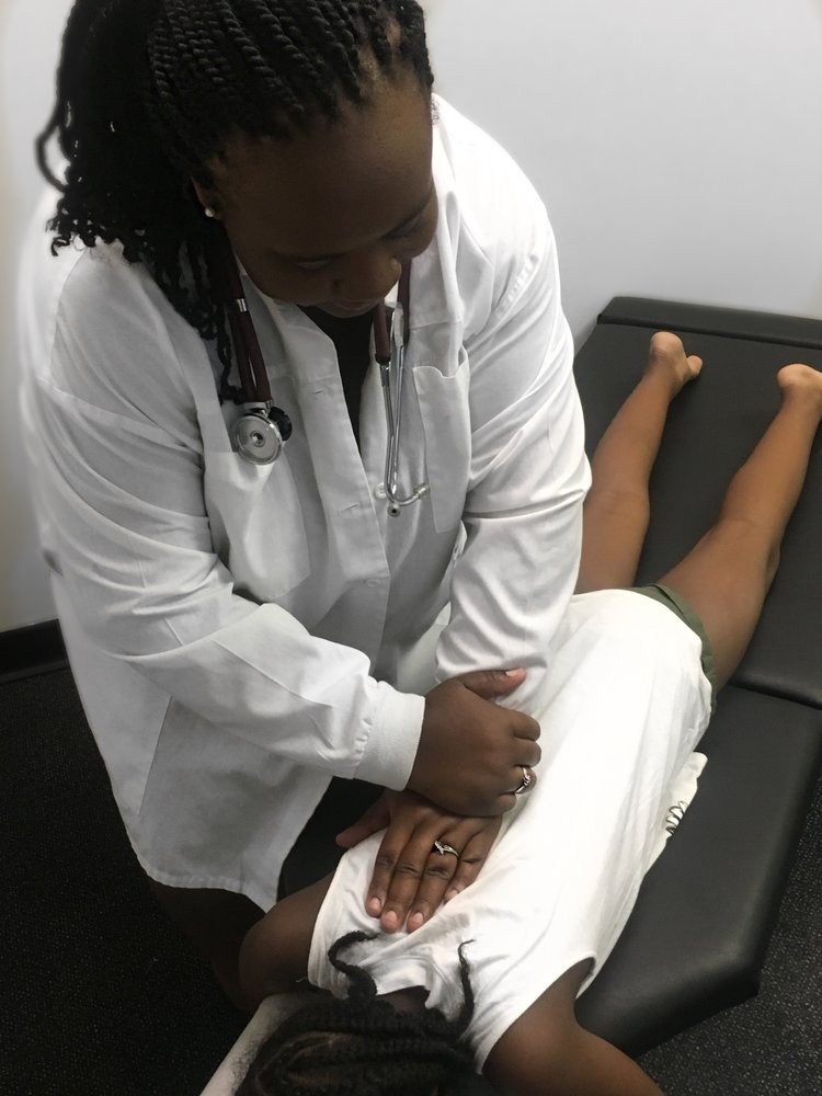 Dr. Williams adjusting patient